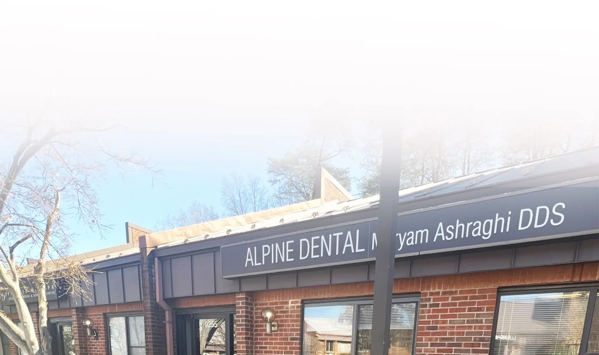 Brick storefront of Alpine Dental, Maryam Ashraghi DDS, at 9255 Old Keene Mill Rd in Burke, VA